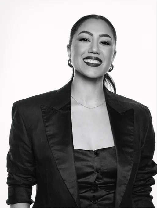 Umbreen Sheikh in a black suit, black and white portrait